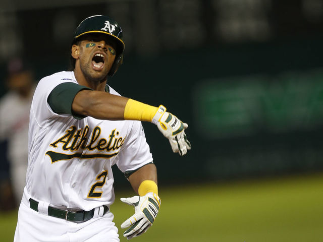 OAKLAND, CA - APRIL 1: Khris Davis #2 of the Oakland Athletics salutes while running the bases after hitting a home run during the game against the Boston Red Sox at the Oakland-Alameda County Coliseum on April 1, 2019 in Oakland, California. The Athletics defeated the Red Sox 7-0.