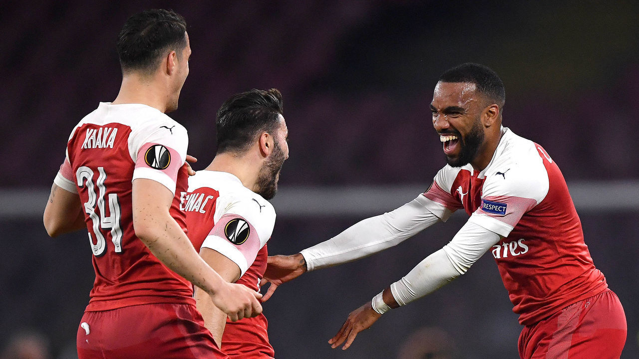 NAPLES, ITALY - APRIL 18: Alexandre Lacazette of Arsenal celebrates scoring his sides first goal with Granit Xhaka and Sead Kolasinac during the UEFA Europa League Quarter Final Second Leg match between S.S.C. Napoli and Arsenal at Stadio San Paolo on April 18, 2019 in Naples, Italy.