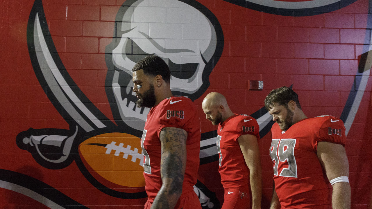 TAMPA, FL - DECEMBER 9: Wide Receiver Mike Evans #13, Punter Bryan Adams #7 and Long Snacker Garrison Sanborn of the Tampa Bay Buccaneers walking back to the later room the game against the New Orleans Saints at Raymond James Stadium on December 9, 2018 in Tampa, Florida. The Saints defeated the Buccaneers 28 to 14 to win the NFC South conference title.