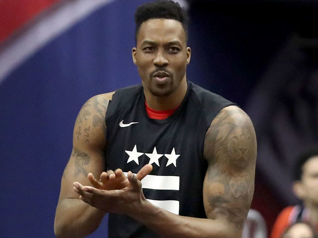 WASHINGTON, DC - APRIL 09: Dwight Howard #21 of the Washington Wizards watches from the bench in the first half against the Boston Celtics at Capital One Arena on April 09, 2019 in Washington, DC.