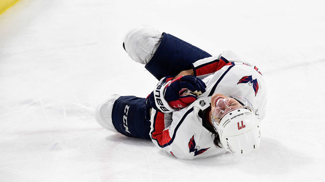 RALEIGH, NORTH CAROLINA - APRIL 18: T.J. Oshie #77 of the Washington Capitals reacts after being injured in the third period against the Carolina Hurricanes in Game Four of the Eastern Conference First Round during the 2019 NHL Stanley Cup Playoffs at PNC Arena on April 18, 2019 in Raleigh, North Carolina. The Hurricanes won 2-1.