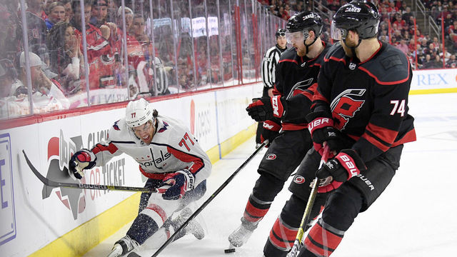 RALEIGH, NORTH CAROLINA - APRIL 18: T.J. Oshie #77 of the Washington Capitals reacts after being injured in the third period against the Carolina Hurricanes in Game Four of the Eastern Conference First Round during the 2019 NHL Stanley Cup Playoffs at PNC Arena on April 18, 2019 in Raleigh, North Carolina. The Hurricanes won 2-1.