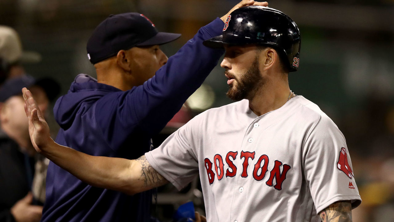 OAKLAND, CALIFORNIA - APRIL 03: Blake Swihart #23 of the Boston Red Sox is congratulated by manager Alex Cora #20 after he a home run in the fifth inning against the Oakland Athletics at Oakland-Alameda County Coliseum on April 03, 2019 in Oakland, California.