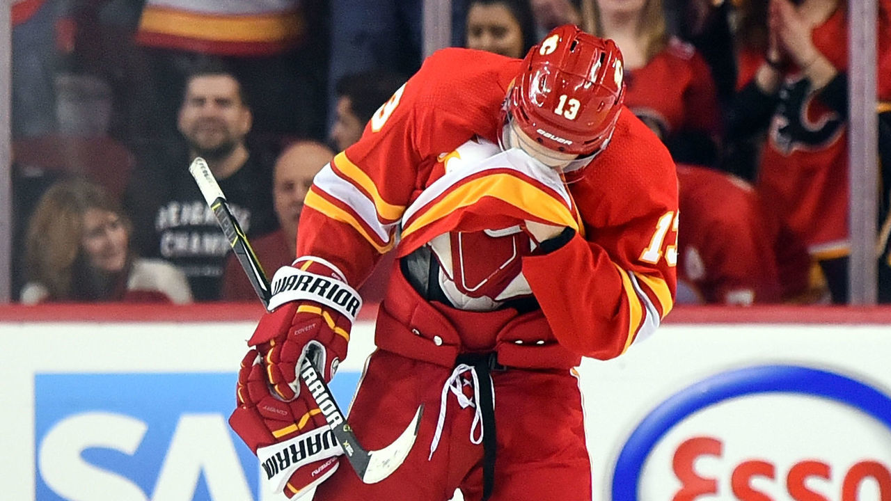CALGARY, AB - APRIL 19: Calgary Flames Left Wing Johnny Gaudreau (13) wipes his face with his jersey after being stopped by Colorado Avalanche Goalie Philipp Grubauer (31) on a penalty shot during the first period of Game Five of the Western Conference First Round during the 2019 Stanley Cup Playoffs where the Calgary Flames hosted the Colorado Avalanche on April 19, 2019, at the Scotiabank Saddledome in Calgary, AB.