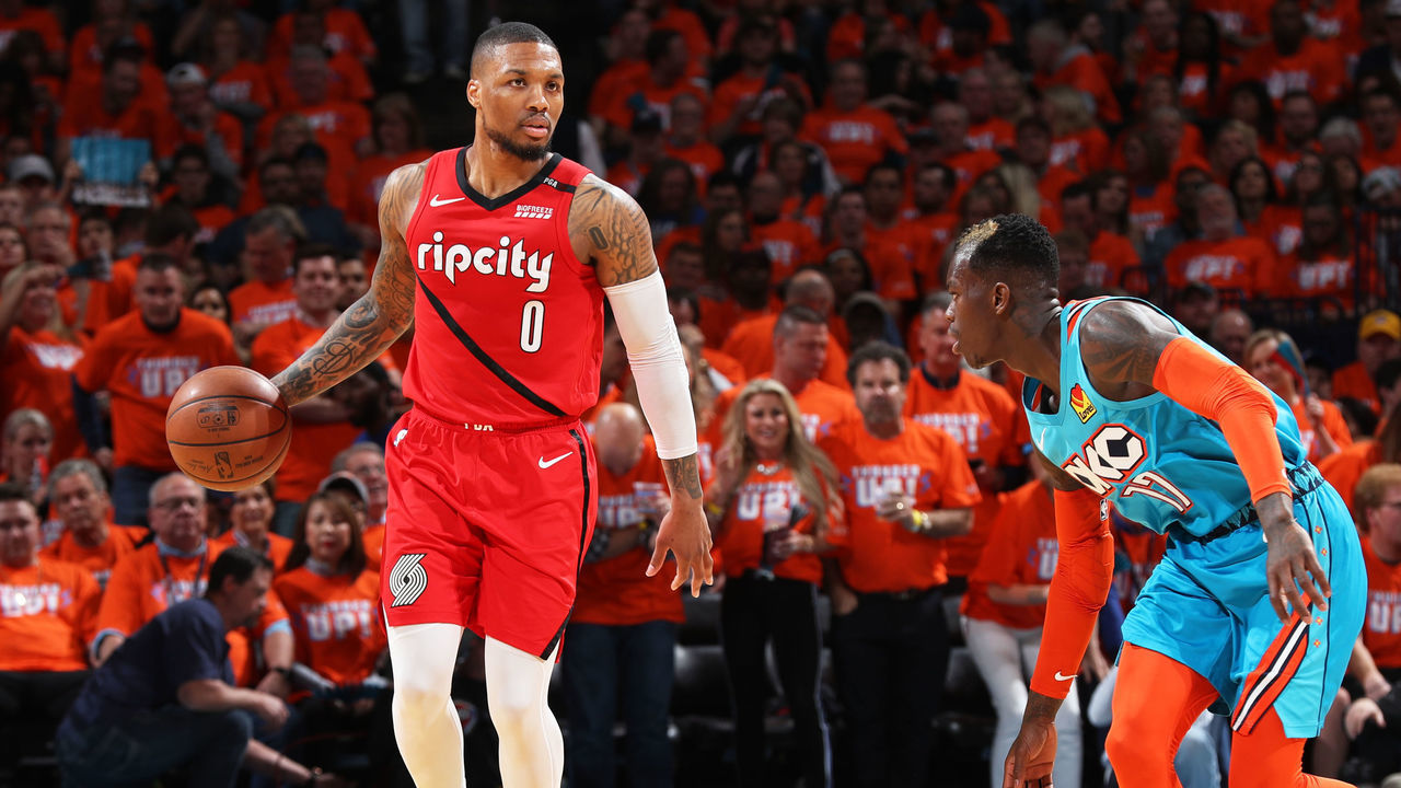 OKLAHOMA CITY, OK - APRIL 19: Damian Lillard #0 of the Portland Trail Blazers handles the ball against Dennis Schroder #17 of the Oklahoma City Thunder during Round One Game Three of the 2019 NBA Playoffs on April 19, 2019 at Chesapeake Energy Arena in Oklahoma City, Oklahoma. Mandatory Copyright Notice: Copyright 2019 NBAE