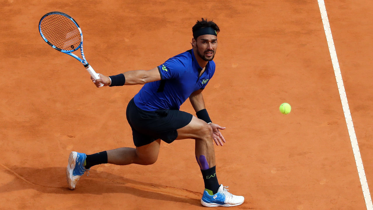 Italy's Fabio Fognini hits a return to Spain's Rafael Nadal during the semi final tennis match of the Monte-Carlo ATP Masters Series tournament in Monaco on April 20, 2019.