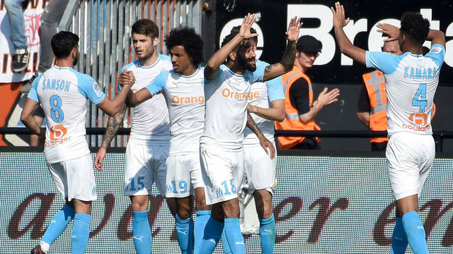 Marseille's players celebrate their second goal during the French L1 football match between Guingamp (EAG) and Olympique de Marseille (OM) at the Roudourou stadium in Guingamp, western France, on April 20, 2019.