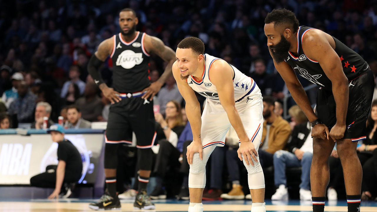 CHARLOTTE, NORTH CAROLINA - FEBRUARY 17: Stephen Curry #30 of the Golden State Warriors and Team Giannis smiles and James Harden #13 of the Houston Rockets and Team LeBron smile in the third quarter during the NBA All-Star game as part of the 2019 NBA All-Star Weekend at Spectrum Center on February 17, 2019 in Charlotte, North Carolina. NOTE TO USER: User expressly acknowledges and agrees that, by downloading and/or using this photograph, user is consenting to the terms and conditions of the Getty Images License Agreement.