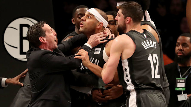 NEW YORK, NEW YORK - APRIL 20: Head coach Kenny Atkinson and Joe Harris #12 of the Brooklyn Nets hold back Jared Dudley #6 at Barclays Center after a foul by Joel Embiid of the Philadelphia 76ers in the third quarter on April 20, 2019 in the Brooklyn borough of New York City.The Philadelphia 76ers defeated the Brooklyn Nets 112-108.