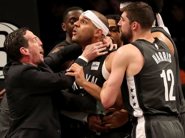 NEW YORK, NEW YORK - APRIL 20: Head coach Kenny Atkinson and Joe Harris #12 of the Brooklyn Nets hold back Jared Dudley #6 at Barclays Center after a foul by Joel Embiid of the Philadelphia 76ers in the third quarter on April 20, 2019 in the Brooklyn borough of New York City.The Philadelphia 76ers defeated the Brooklyn Nets 112-108.