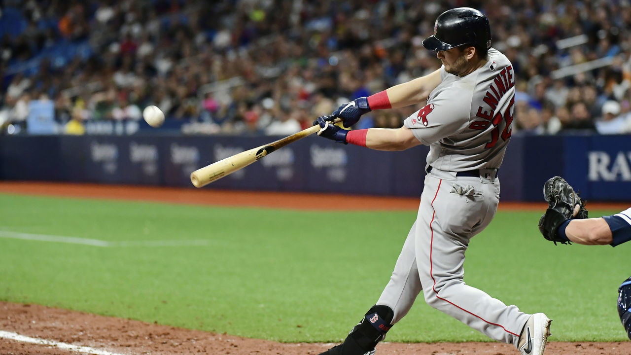 ST. PETERSBURG, FLORIDA - APRIL 20: Andrew Benintendi #16 of the Boston Red Sox hits a sacrifice fly out for Jackie Bradley Jr. #19 to score the go-ahead against the Tampa Bay Rays in the ninth inning at Tropicana Field on April 20, 2019 in St. Petersburg, Florida.