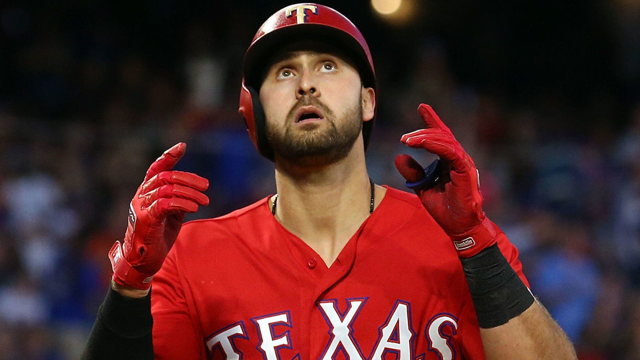 ARLINGTON, TEXAS - APRIL 20: Joey Gallo #13 of the Texas Rangers gestures upward as he crosses the plate after a solo home run in the third inning against the Houston Astros at Globe Life Park in Arlington on April 20, 2019 in Arlington, Texas.