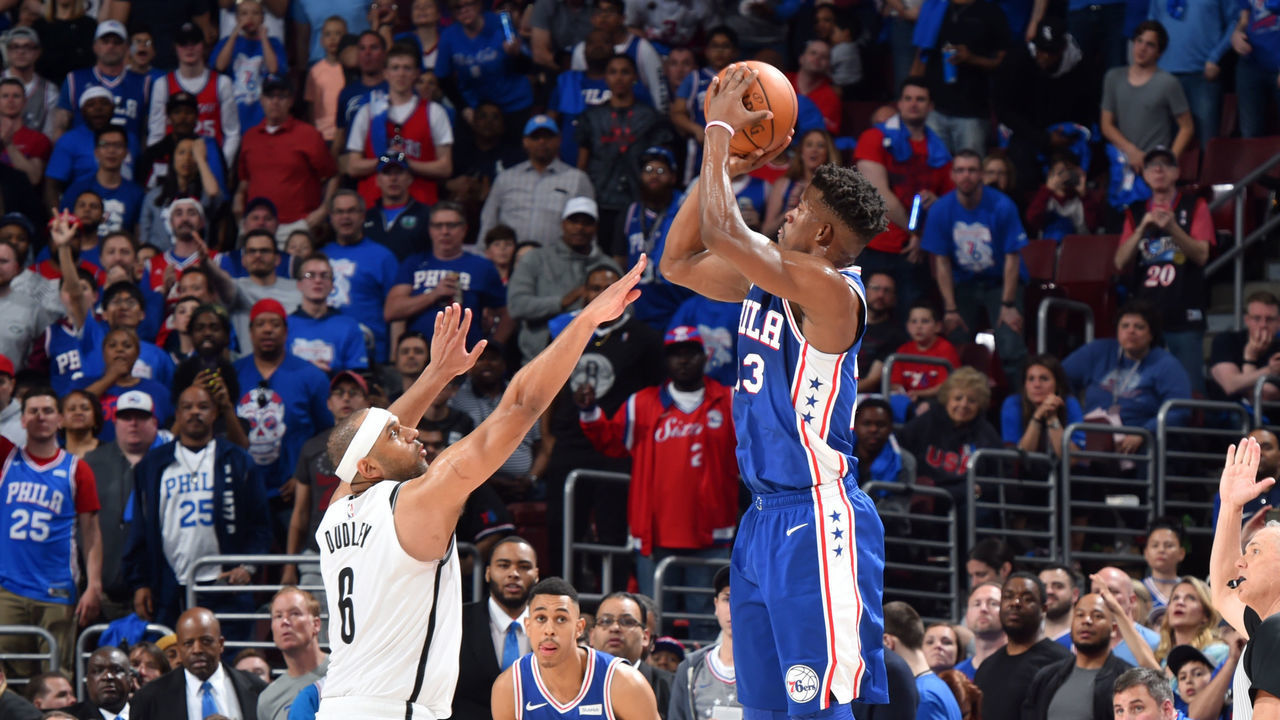 PHILADELPHIA, PA - APRIL 13: Jimmy Butler #23 of the Philadelphia 76ers shoots a three-pointer against Jared Dudley #6 of the Brooklyn Nets during Game One of Round One of the 2019 NBA Playoffs on April 13, 2019 at the Wells Fargo Center in Philadelphia, Pennsylvania NOTE TO USER: User expressly acknowledges and agrees that, by downloading and/or using this Photograph, user is consenting to the terms and conditions of the Getty Images License Agreement. Mandatory Copyright Notice: Copyright 2019 NBAE