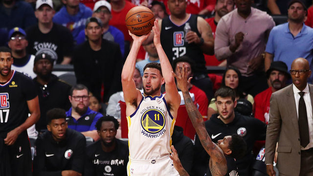 LOS ANGELES, CALIFORNIA - APRIL 21: Klay Thompson #11 of the Golden State Warriors shoots the ball against Lou Williams #23 of the Los Angeles Clippers during the second half of Game Four of Round One of the 2019 NBA Playoffs at Staples Center on April 21, 2019 in Los Angeles, California.