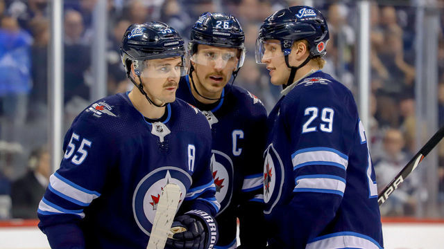 WINNIPEG, MB - NOVEMBER 9: Mark Scheifele #55, Blake Wheeler #26 and Patrik Laine #29 of the Winnipeg Jets discuss strategy during a second period stoppage in play against the Colorado Avalanche at the Bell MTS Place on November 9, 2018 in Winnipeg, Manitoba, Canada.