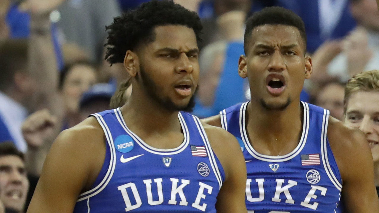 OMAHA, NE - MARCH 25: Marques Bolden #20 and Javin DeLaurier #12 of the Duke Blue Devils celebrate a three point basket with their teammates against the Kansas Jayhawks during the second half in the 2018 NCAA Men's Basketball Tournament Midwest Regional at CenturyLink Center on March 25, 2018 in Omaha, Nebraska.