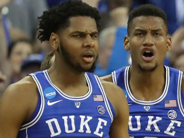 OMAHA, NE - MARCH 25: Marques Bolden #20 and Javin DeLaurier #12 of the Duke Blue Devils celebrate a three point basket with their teammates against the Kansas Jayhawks during the second half in the 2018 NCAA Men's Basketball Tournament Midwest Regional at CenturyLink Center on March 25, 2018 in Omaha, Nebraska.