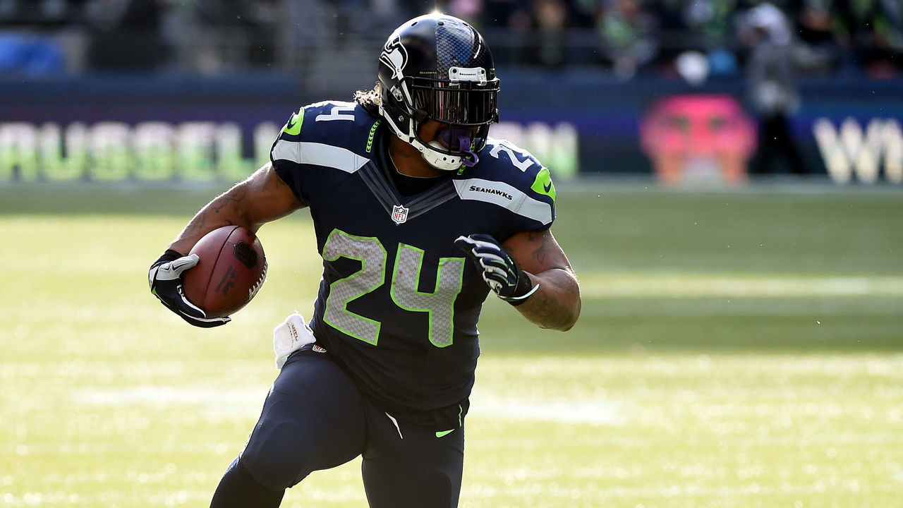 SEATTLE, WA - NOVEMBER 23: Marshawn Lynch #24 of the Seattle Seahawks runs the ball in the first quarter against the Arizona Cardinals during their game at CenturyLink Field on November 23, 2014 in Seattle, Washington.