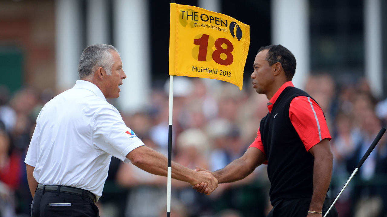 GULLANE, SCOTLAND - JULY 21: Tiger Woods of the United States shakes hands with Steve Williams the caddie of Adam Scott on the 18th green during the final round of the 142nd Open Championship at Muirfield on July 21, 2013 in Gullane, Scotland.