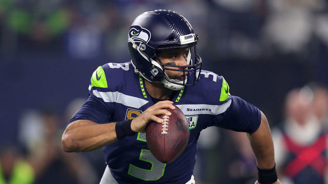 ARLINGTON, TEXAS - JANUARY 05: Russell Wilson #3 of the Seattle Seahawks scrambles in the pocket against the Dallas Cowboys in the first half during the Wild Card Round at AT&T Stadium on January 05, 2019 in Arlington, Texas.