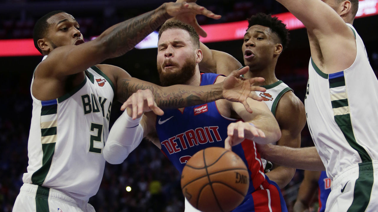DETROIT, MI - APRIL 22: Blake Griffin #23 of the Detroit Pistons is is defended by Sterling Brown #23, Giannis Antetokounmpo #34 and Brook Lopez #11 of the Milwaukee Bucks while going to the basket during the first quarter of Game Four of the first round of the 2019 NBA Eastern Conference Playoffs at Little Caesars Arena on April 22, 2019 in Detroit, Michigan.