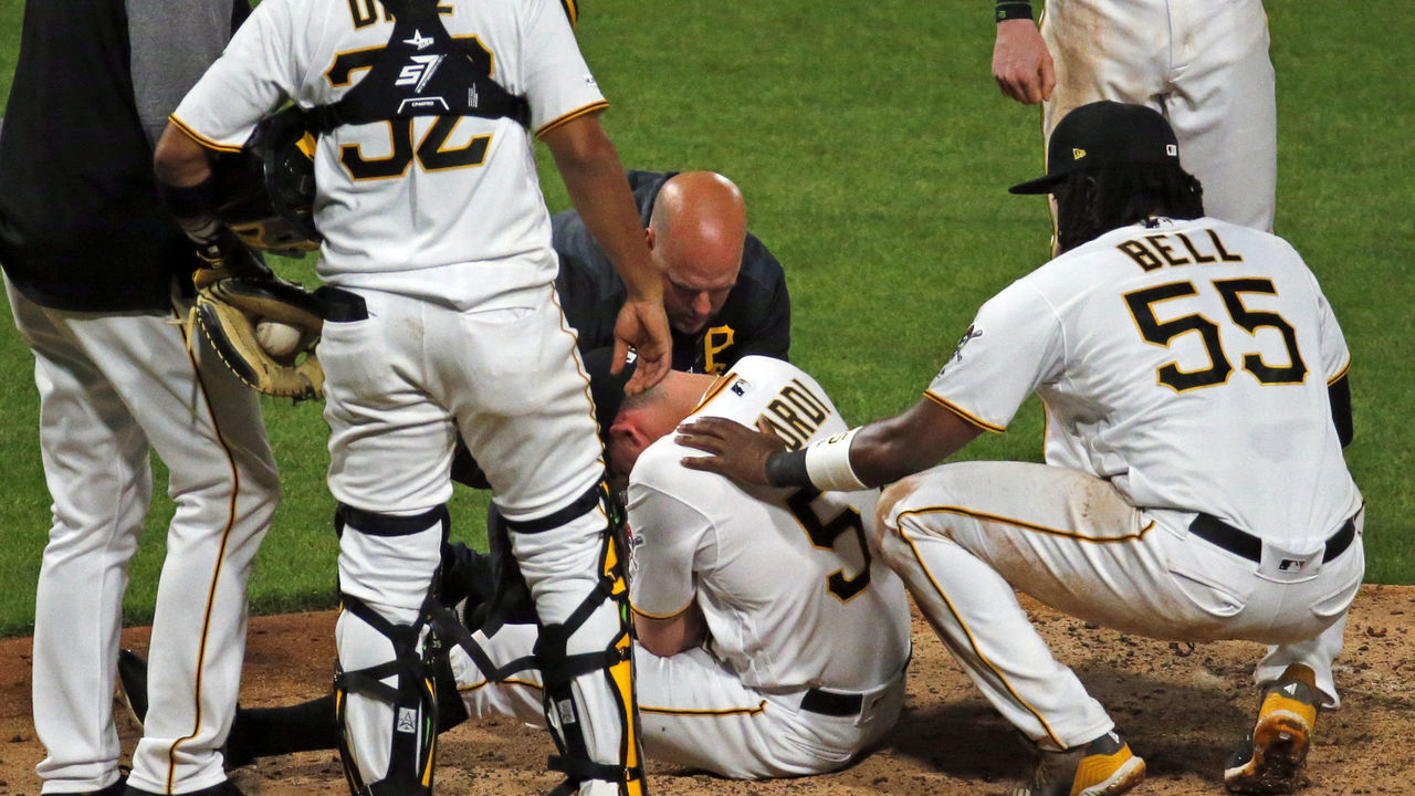 PITTSBURGH, PA - APRIL 22: Nick Burdi #57 of the Pittsburgh Pirates lays injured on the ground in the eighth inning against the Arizona Diamondbacks at PNC Park on April 22, 2019 in Pittsburgh, Pennsylvania.