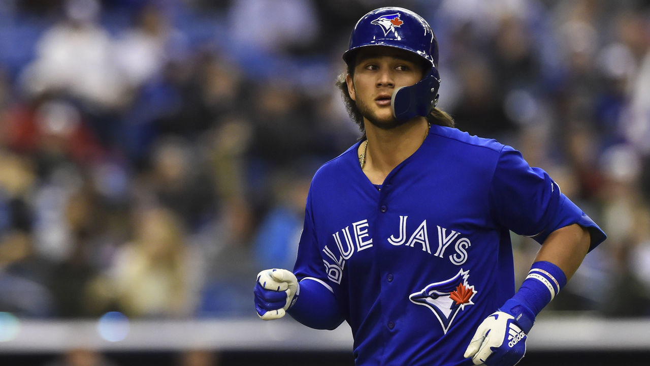 MONTREAL, QC - MARCH 25: Bo Bichette #66 of the Toronto Blue Jays runs off the field against the Milwaukee Brewers during MLB spring training at Olympic Stadium on March 25, 2019 in Montreal, Quebec, Canada. The Milwaukee Brewers defeated the Toronto Blue Jays 10-5.