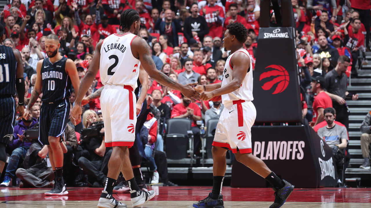 TORONTO, CANADA - APRIL 23: Kawhi Leonard #2, and Kyle Lowry #7 of the Toronto Raptors hi-five each other during Game Five of Round One of the 2019 NBA Playoffs against the Orlando Magic on April 23, 2019 at the Scotiabank Arena in Toronto, Ontario, Canada. Mandatory Copyright Notice: Copyright 2019 NBAE