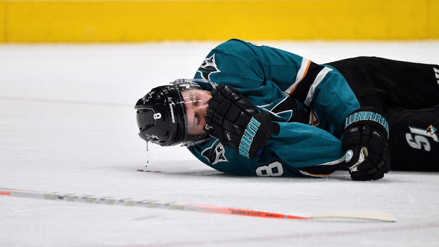 SAN JOSE, CA - APRIL 23: Joe Pavelski #8 of the San Jose Sharks lies on ice after being hit in the head against the Vegas Golden Knights in Game Seven of the Western Conference First Round during the 2019 NHL Stanley Cup Playoffs at SAP Center on April 23, 2019 in San Jose, California
