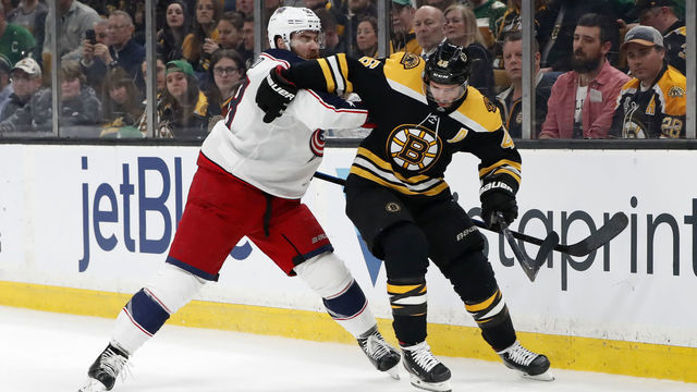 BOSTON, MA - MARCH 16: Columbus Blue Jackets defenseman David Savard (58) tries to stop Boston Bruins center David Krejci (46) during a game between the Boston Bruins and the Columbus Blue Jackets on. March 16, 2019, at TD Garden in Boston, Massachusetts.