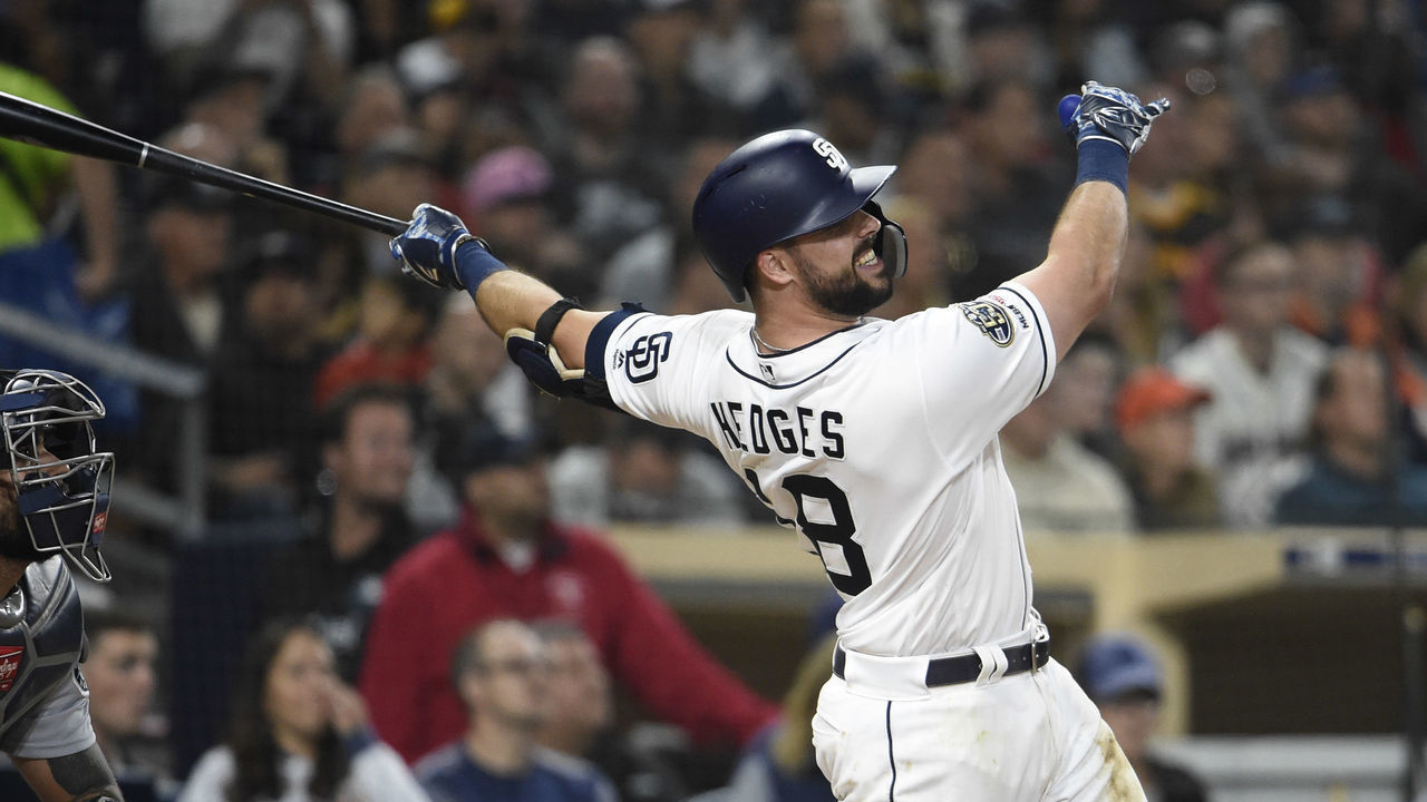 SAN DIEGO, CA - APRIL 23: Austin Hedges #18 of the San Diego Padres hits a two-run home run during the sixth inning of a baseball game against the Seattle Mariners at Petco Park April 23, 2019 in San Diego, California.