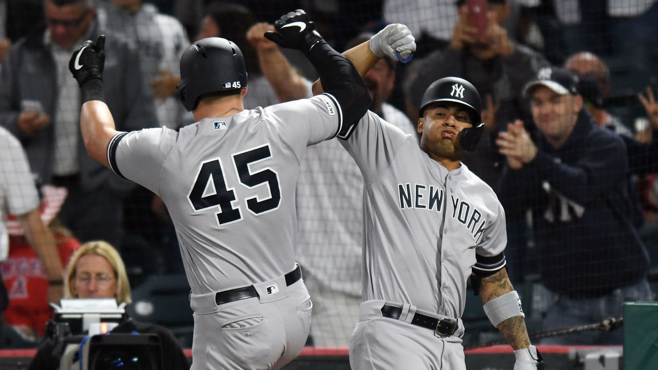 ANAHEIM, CA - APRIL 23: New York Yankees shortstop Gleyber Torres (25) greats designated hitter Luke Voit (45) after Voit hit a solo home run in the eight inning of a game against the Los Angeles Angels played on April 23, 2019 at Angel Stadium of Anaheim in Anaheim, CA.