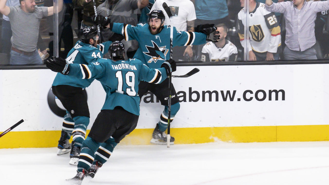 SAN JOSE, CA - APRIL 23: San Jose Sharks center Joe Thornton (19) and San Jose Sharks defenseman Marc-Edouard Vlasic (44) rush in to congratulate San Jose Sharks right wing Barclay Goodrow (23) for the game winning goal in Game 7, Round 1 between the Vegas Golden Knights and the San Jose Sharks on Tuesday, April 23, 2019 at the SAP Center, San Jose, CA.