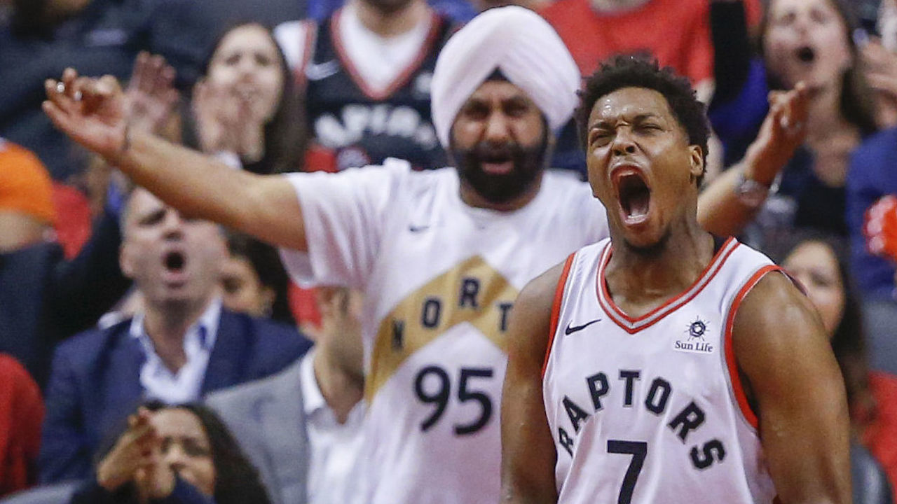 TORONTO, ON - APRIL 23: Toronto Raptors guard Kyle Lowry (7) lets out a scream after making a difficult drive as SuperFan Nav Bhatia yells in support. Toronto Raptors vs Orlando Magic in 2nd half action of Round 1, Game 5 of NBA playoff play at Scotiabank Arena. Raptors eliminate the Magic with a 115-96 win to take the series 4-1. Toronto Star/Rick Madonik (Rick Madonik/Toronto Star via Getty Images)