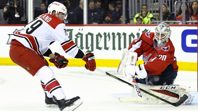 WASHINGTON, DC - APRIL 11: Washington Capitals goaltender Braden Holtby (70) makes a save on shot by Carolina Hurricanes left wing Micheal Ferland (79) in the first period on April 11, 2019, at the Capital One Arena in Washington, D.C. in the first round of the Stanley Cup Playoffs.