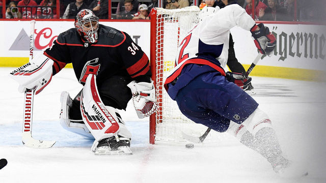 RALEIGH, NORTH CAROLINA - APRIL 22: Petr Mrazek #34 of the Carolina Hurricanes defends the goal against Evgeny Kuznetsov #92 of the Washington Capitals in the third period of Game Six of the Eastern Conference First Round during the 2019 NHL Stanley Cup Playoffs at PNC Arena on April 22, 2019 in Raleigh, North Carolina. The Hurricanes won 5-2.