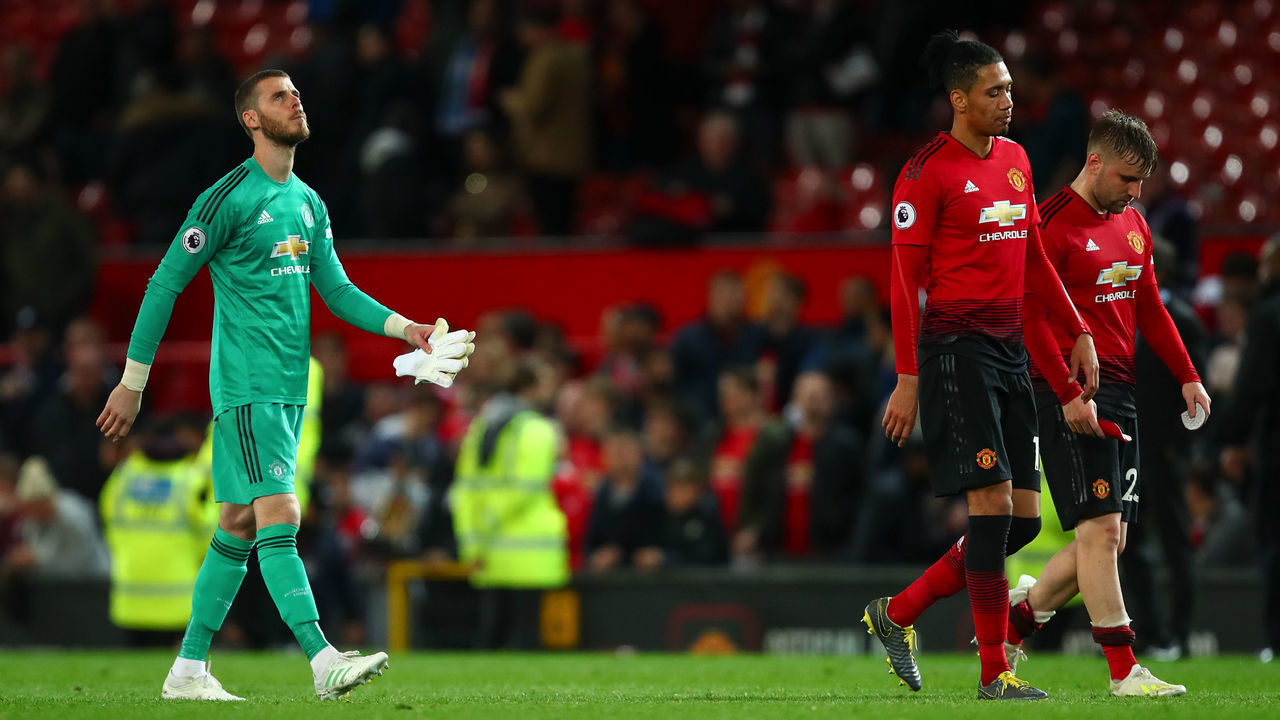 MANCHESTER, ENGLAND - APRIL 24: A dejected David de Gea of Manchester United, Chris Smalling of Manchester United and Luke Shaw of Manchester United walk off at full time during the Premier League match between Manchester United and Manchester City at Old Trafford on April 24, 2019 in Manchester, United Kingdom.