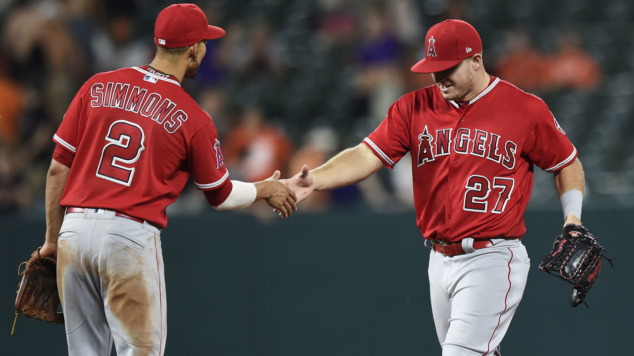 BALTIMORE, MD - JUNE 29: Mike Trout #27 and Andrelton Simmons #2 of the Los Angeles Angels of Anaheim celebrate after defeating the Baltimore Orioles 7-1 at Oriole Park at Camden Yards on June 29, 2018 in Baltimore, Maryland.