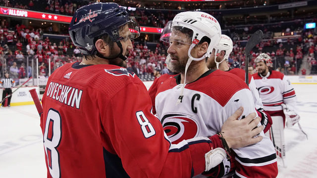 WASHINGTON, DC - APRIL 24: Alex Ovechkin #8 of the Washington Capitals and Justin Williams #14 of the Carolina Hurricanes shake hands after the Hurricanes defeated the Capitals 4-3 in the second overtime period in Game Seven of the Eastern Conference First Round during the 2019 NHL Stanley Cup Playoffs at Capital One Arena on April 24, 2019 in Washington, DC.