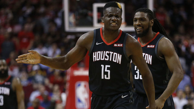 HOUSTON, TEXAS - MARCH 13: Clint Capela #15 of the Houston Rockets and Kenneth Faried #35 react after an offensive run against the Golden State Warriors at Toyota Center on March 13, 2019 in Houston, Texas.