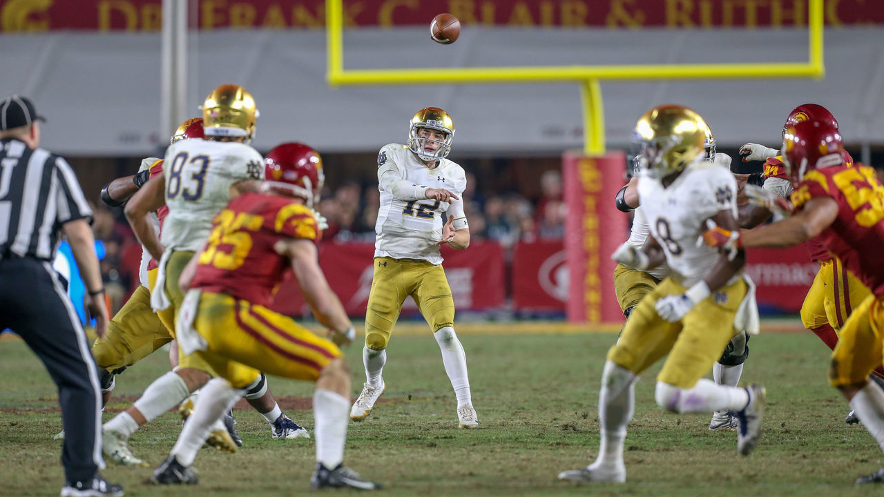 LOS ANGELES, CA - NOVEMBER 24: Notre Dame Fighting Irish quarterback Ian Book (12) throws the ball during a college football game between the Notre Dame Fighting Irish versus USC Trojans on November 24, 2018, at Los Angeles Memorial Coliseum in Los Angeles, CA.