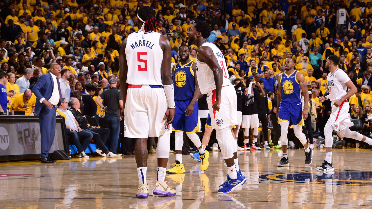 OAKLAND, CA - APRIL 24: Montrezl Harrell #5 and Patrick Beverley #21 of the LA Clippers react to a play against the Golden State Warriors during Game Five of Round One of the 2019 NBA Playoffs on April 24, 2019 at ORACLE Arena in Oakland, California. NOTE TO USER: User expressly acknowledges and agrees that, by downloading and/or using this photograph, user is consenting to the terms and conditions of Getty Images License Agreement. Mandatory Copyright Notice: Copyright 2019 NBAE