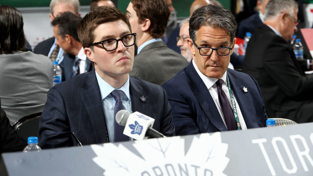 DALLAS, TX - JUNE 23: (l-r) Kyle Dubas and Brendan Shanahan of the Toronto Maple Leafs handle the draft table during the 2018 NHL Draft at American Airlines Center on June 23, 2018 in Dallas, Texas.