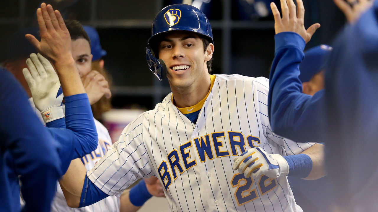 MILWAUKEE, WISCONSIN - APRIL 20: Christian Yelich #22 of the Milwaukee Brewers celebrates with teammates after hitting a home run in the sixth inning against the Los Angeles Dodgers at Miller Park on April 20, 2019 in Milwaukee, Wisconsin.