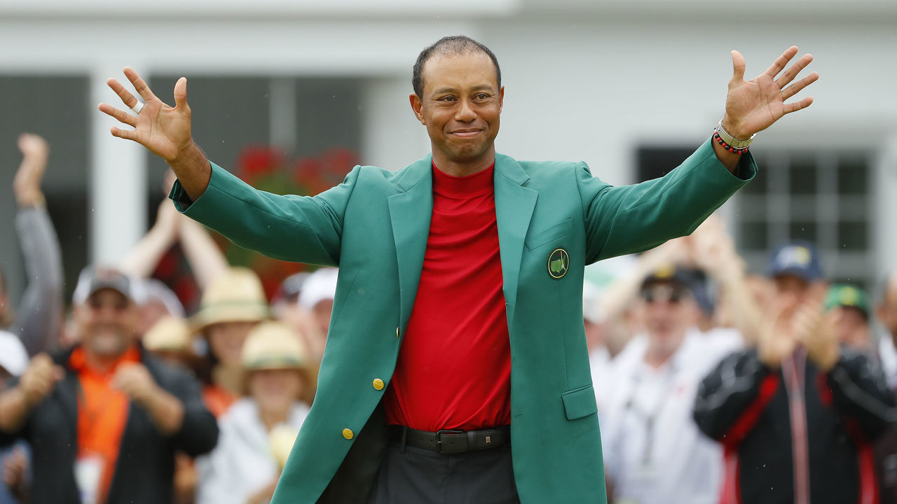 AUGUSTA, GEORGIA - APRIL 14: Tiger Woods of the United States smiles after being awarded the Green Jacket during the Green Jacket Ceremony after winning the Masters at Augusta National Golf Club on April 14, 2019 in Augusta, Georgia.