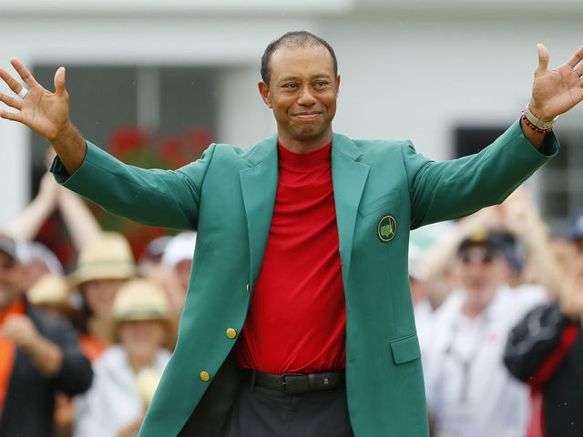 AUGUSTA, GEORGIA - APRIL 14: Tiger Woods of the United States smiles after being awarded the Green Jacket during the Green Jacket Ceremony after winning the Masters at Augusta National Golf Club on April 14, 2019 in Augusta, Georgia.