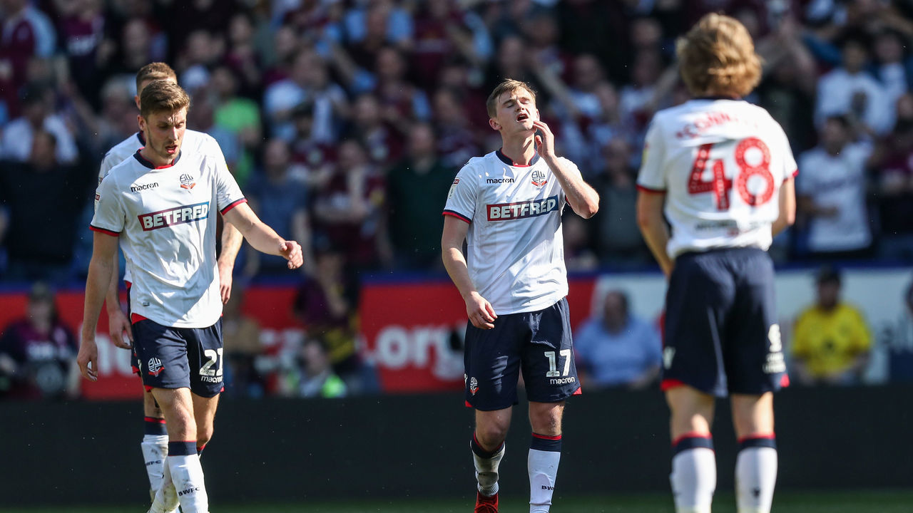 BOLTON, ENGLAND - APRIL 19: Bolton Wanderers' Joe Williams , Callum Connolly and Luca Connell after conceding a second goal during the Sky Bet Championship match between Bolton Wanderers and Aston Villa at Macron Stadium on April 19, 2019 in Bolton, England.