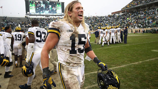 EAST LANSING, MI - OCTOBER 20: Chase Winovich #15 of the Michigan Wolverines celebrates on the sideline as the clock winded down on a 21-7 win over the Michigan State Spartans at Spartan Stadium on October 20, 2018 in East Lansing, Michigan.