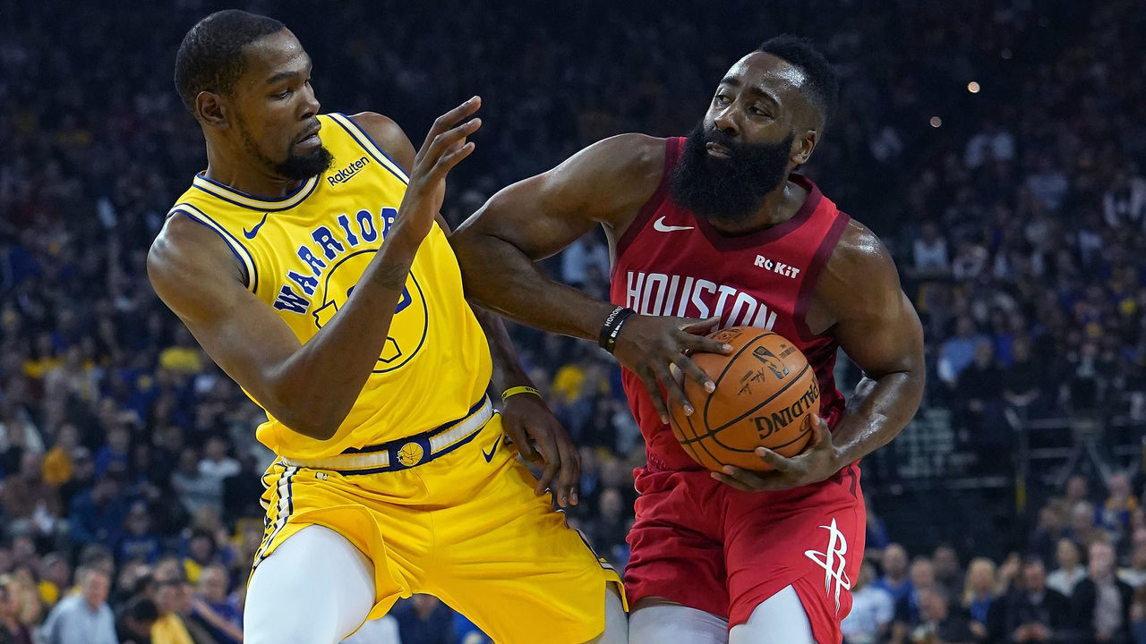 OAKLAND, CA - JANUARY 03: James Harden #13 of the Houston Rockets drives towards the basket on Kevin Durant #35 of the Golden State Warriors during an NBA basketball game at ORACLE Arena on January 3, 2019 in Oakland, California.