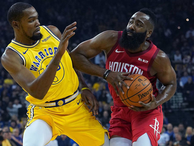 OAKLAND, CA - JANUARY 03: James Harden #13 of the Houston Rockets drives towards the basket on Kevin Durant #35 of the Golden State Warriors during an NBA basketball game at ORACLE Arena on January 3, 2019 in Oakland, California.
